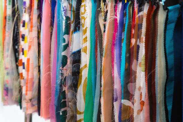istock Fabric and textiles samples in a factory shop or store. Different colours and patterns on the market. Industrial fabrics. 1059678508