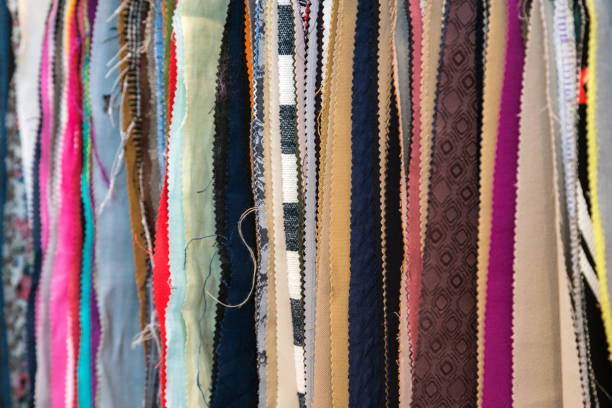 istock Fabric and textiles samples in a factory shop or store. Different colours and patterns on the market. Industrial fabrics. 1059678666