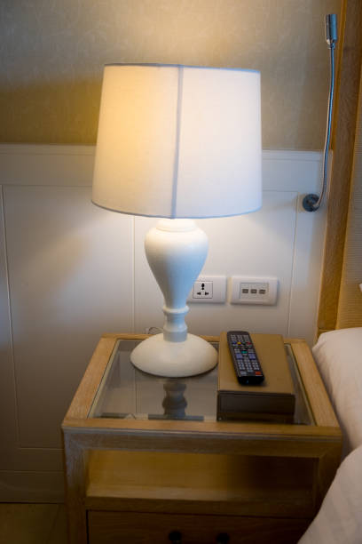 istock White lamp near bed in hotel room 1059680518