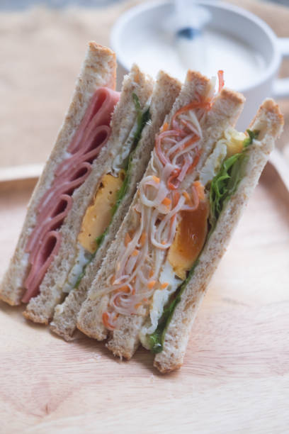 istock Two sliced sandwiches cut with different filling 1059680664