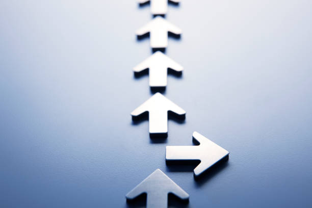 istock Row Of Arrows With One Pointing In A Different Direction 1059686192