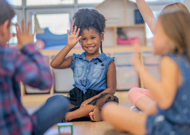 istock Black girl raising her hand 1059688422