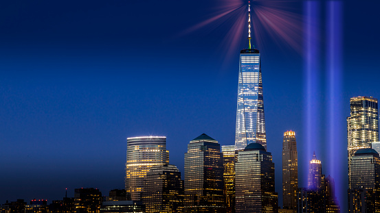 This picture was shot at 11th September 2018 from Brooklyn Park with view to Manhattan. The light columms are in memory of the victims and heroes of 9/11 and are called \