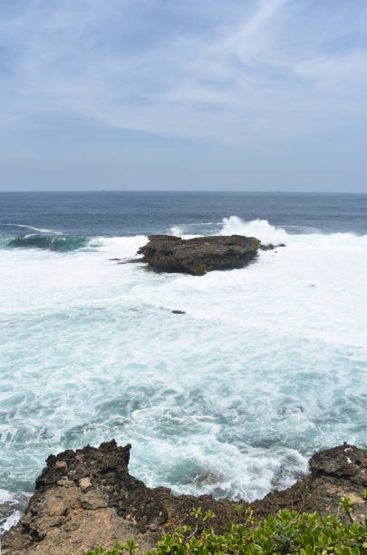 istock The rock between the high seas on the south coast 1059689626