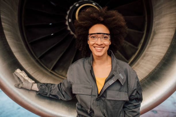 istock Smiling woman wearing mechanic uniform 1059697400