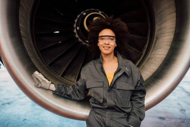 istock Happy woman leaning on aircraft 1059697408