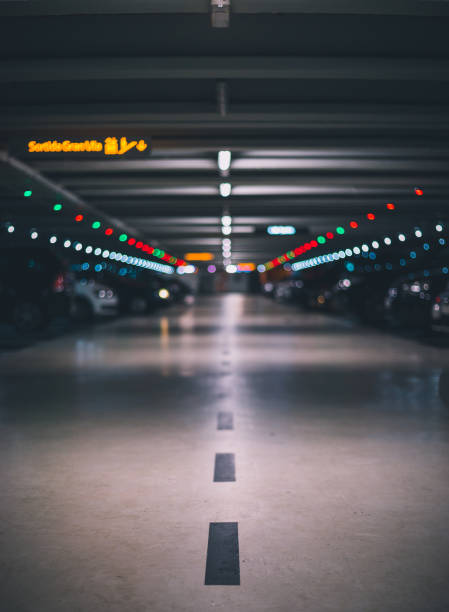 istock Full indor parking low shot with parked cars 1059699362