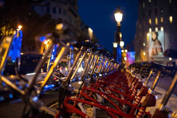 istock Parked city bikes for rental at night 1059699422