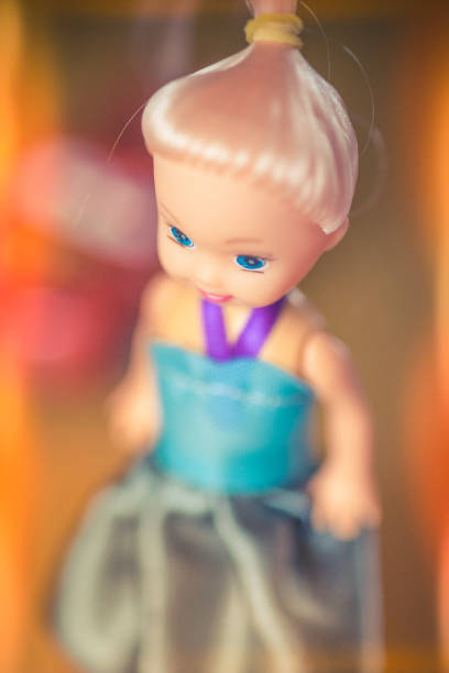 istock doll with pink hair with a ponytail. Portrait with selective focus. 1059699456