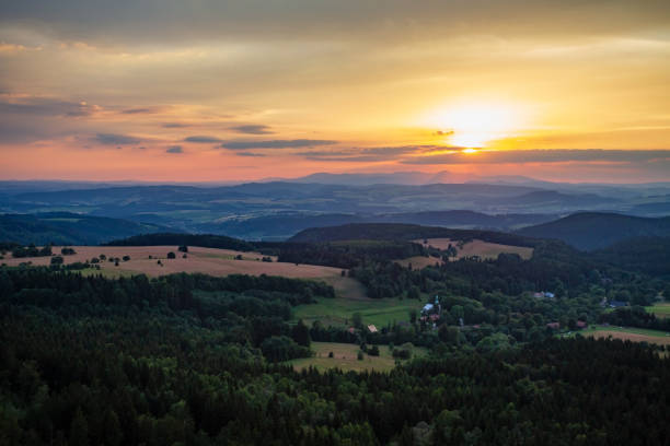 istock Summer sunset landscape green forest and mountains 1059707500