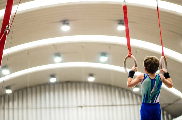 Portrait of gymnast boy competing in the stadium stock photo