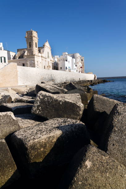 Seafront with catholic Church Chiesa San Salvatore in Monopoli, Adriatic sea, Italy, sunny summer day Seafront with catholic Church Chiesa San Salvatore in Monopoli, Adriatic sea, Italy, sunny summer day monopoli puglia stock pictures, royalty-free photos & images
