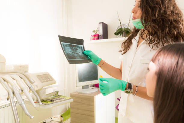 istock Young woman at the dentist 1059719630