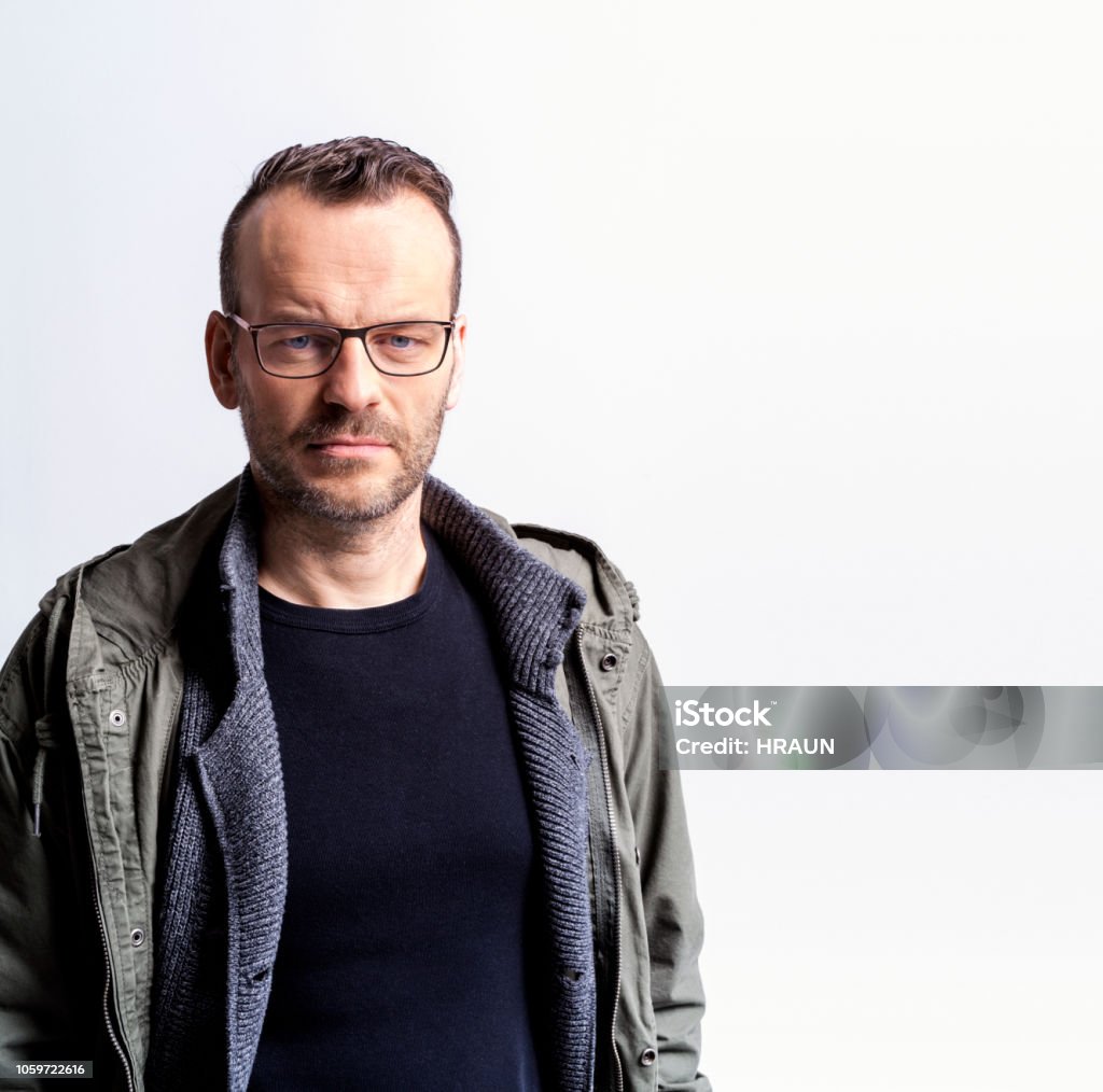 Confident mid age man posing in studio Confident mid age man with eyeglasses posing in studio 40-44 Years Stock Photo