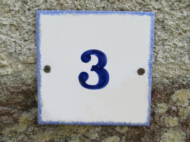 istock Ceramic street number plate with number 3 1059724600
