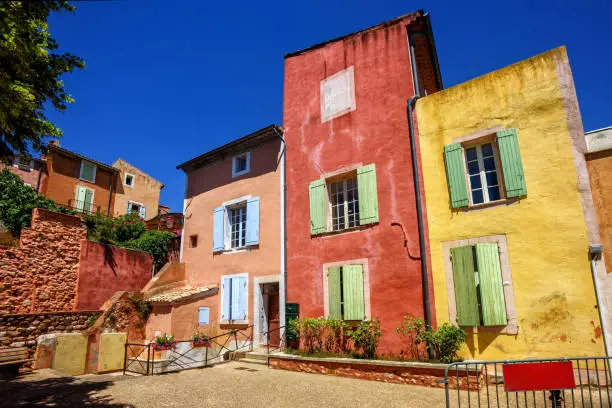 Traditional colorful houses in the Old Town of Roussillon, Provence, France