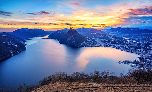 Dramatic sunset over Lake Lugano in swiss Alps, Ticino, Switzerland