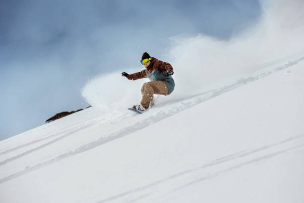 istock Snowboarder off-piste slope downhill fast 1059725966