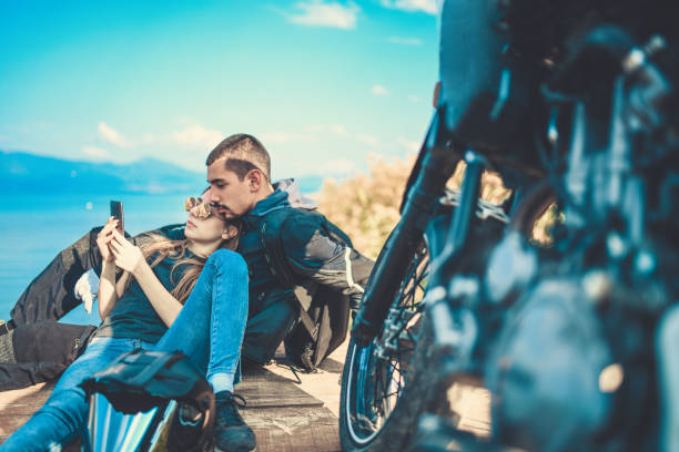 istock Beautiful Couple Checking Map Before Taking A Motorcycle Ride 1059727768
