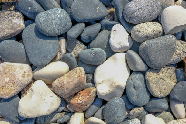 istock Background shot of smooth pebbles found on the beach. 1059729788