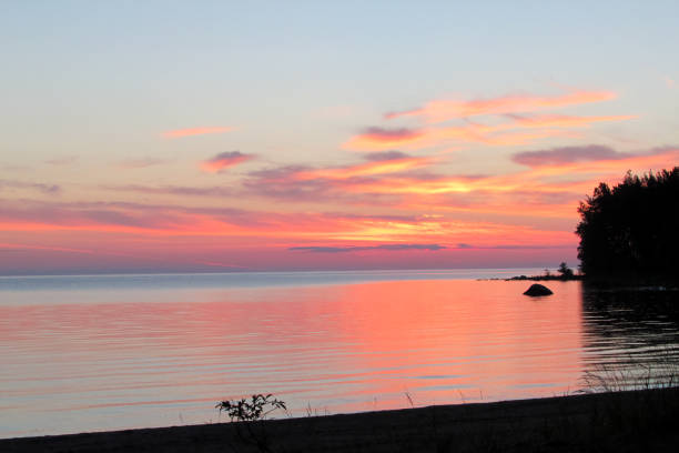 istock sunset on the lake, clouds 1059737748