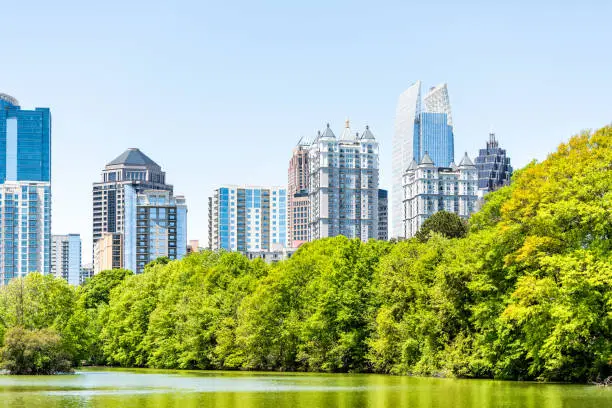 Atlanta, USA Cityscape, skyline view in Piedmont Park in Georgia downtown, green trees, scenic urban city skyscrapers
