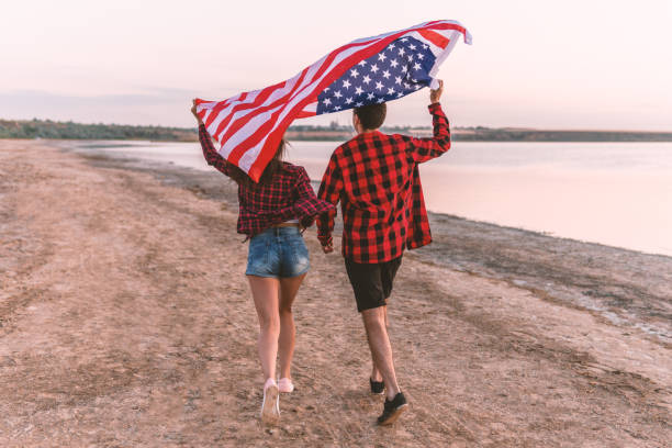 istock oung couple on the beach walking together 1059742642