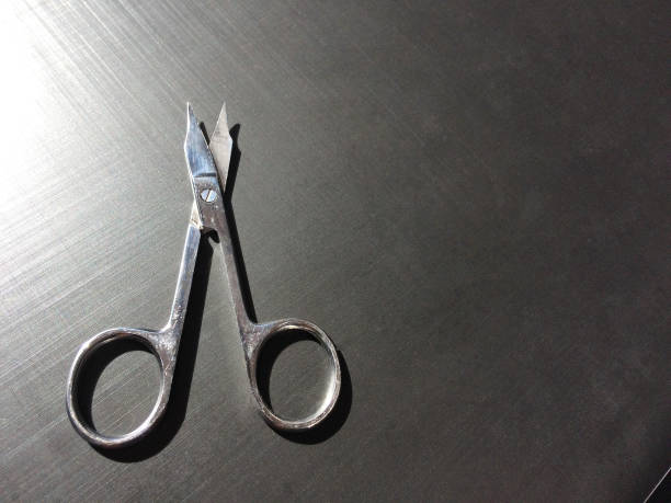 istock small nail scissors on a dark background 1059744692