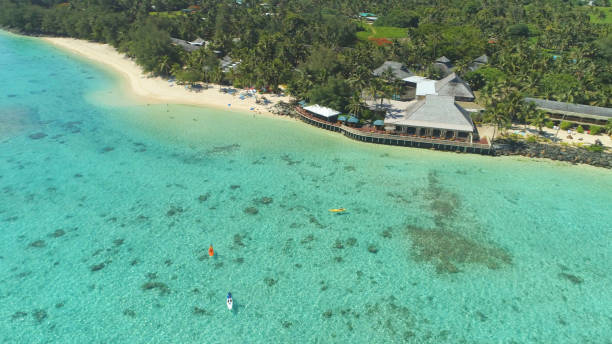 istock AERIAL: Unrecognizable people on vacation having fun in the turquoise water. 1059748384