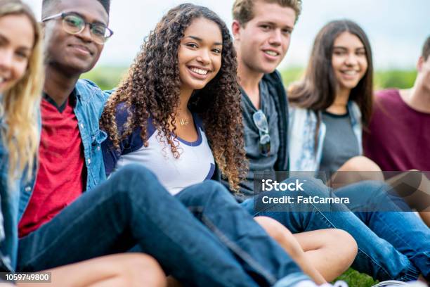 Friends Pose For A Photo Stock Photo - Download Image Now - Teenagers Only, Outdoors, Multiracial Group