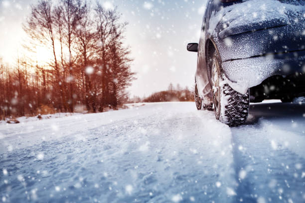 istock Car tires on winter road covered with snow 1059752450