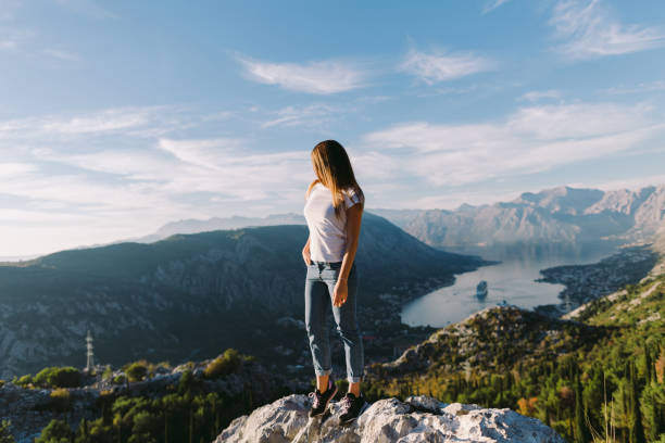 istock beautiful woman relax in mountains 1059752636