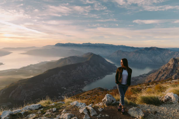 istock woman relax in mountains at sunset 1059752652