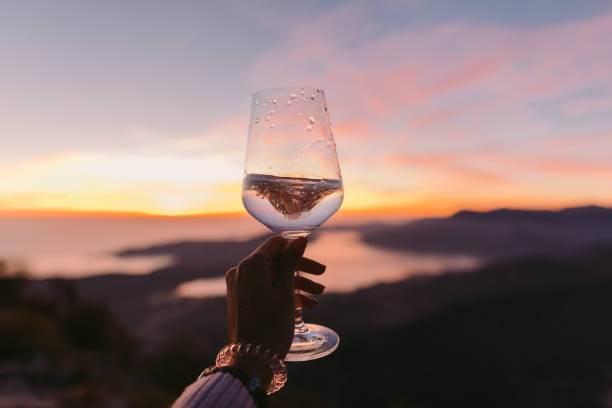 istock champagne glass at sunset 1059755426