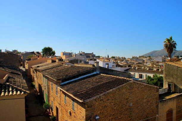 Roofs of old, roman town of Alcudia houses on sunny day on Mallorca Island.