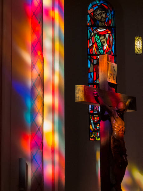 Paris, France: A stained glass window showing the crucifix inside the Church of Saint Jean de Montmartre, located in Montmartre. The window is art nouveau style.
