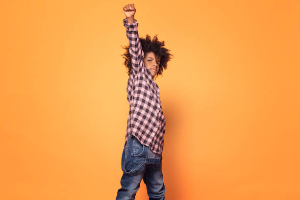 istock Little boy with afro hairstyle posing. 1059767464