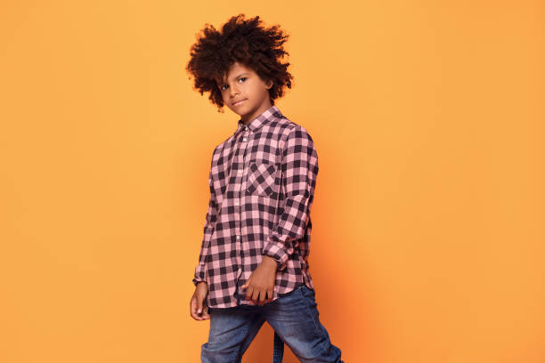 istock Little boy with afro hairstyle posing. 1059767544