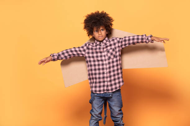 istock Little boy with afro hairstyle posing. 1059767570