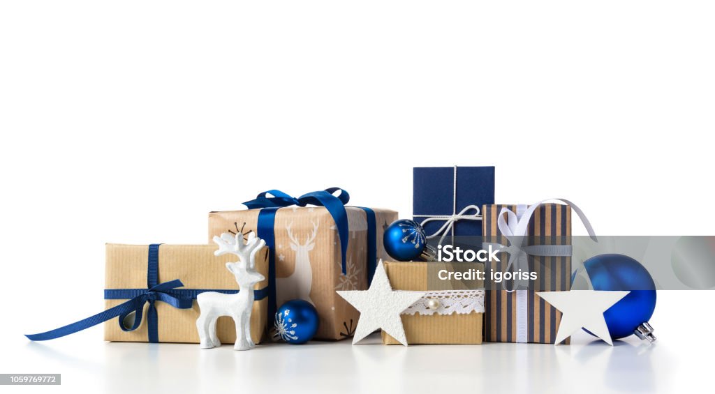 Gift boxes and christmas blue balls on white. Christmas Gift boxes set with christmas blue balls and baubles and deer on white background. Christmas Present Stock Photo