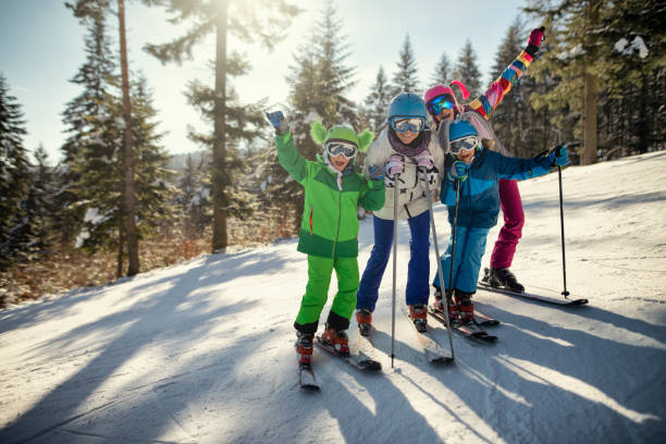 istock Family having fun skiing 1059769826