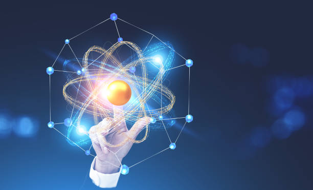istock Woman hand touching atom model hologram 1059770000