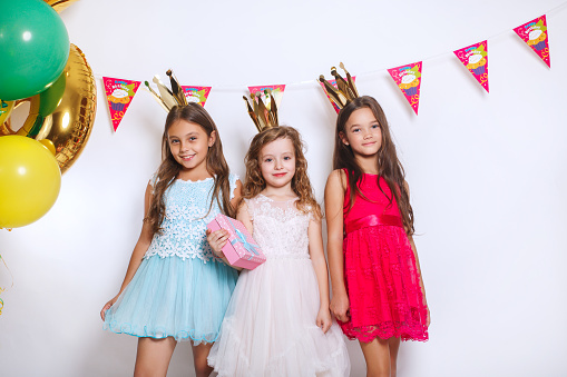 Group of kids celebrate birthday party together. Holidays concept.