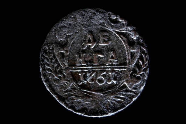 istock old Russian coin 1 Denga 1798 on black isolated background 1059771620