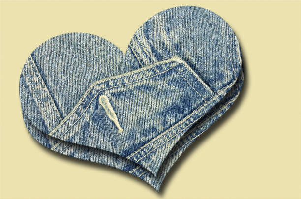 istock Two Jeans Hearts on Beige 1059771980
