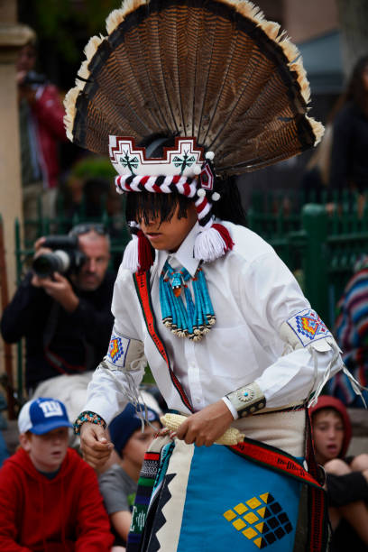Indigenous Peoples Day Santa Fe, NM - October 8, 2018: A Native-American teenage boy from Zuni Pueblo in New Mexico dances at Indigenous Peoples Day in Santa Fe, New Mexico. indigenous peoples day stock pictures, royalty-free photos & images