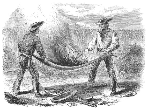 Winnowing for gold in California, United States of America (circa mid 19th century). Vintage etching circa mid 19th century.