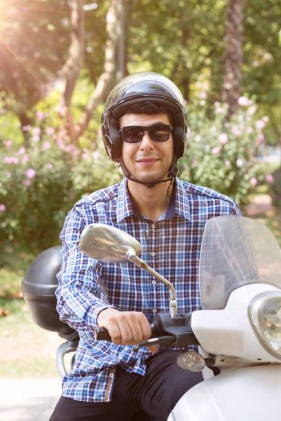 istock Handsome Biker man sits on a bike. 1059788780