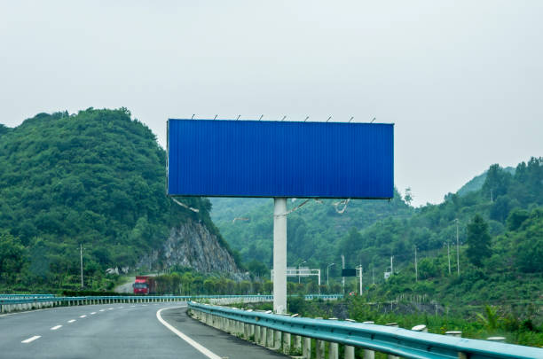 istock Blank billboard on blue sky background for new advertisement 1059798752