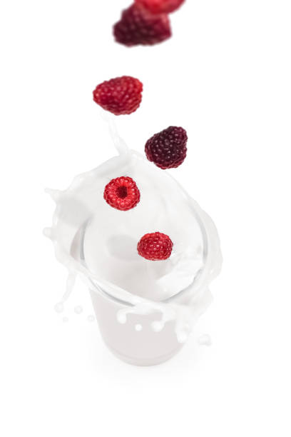 istock raspberry  falling into a glass of milk 1059799202